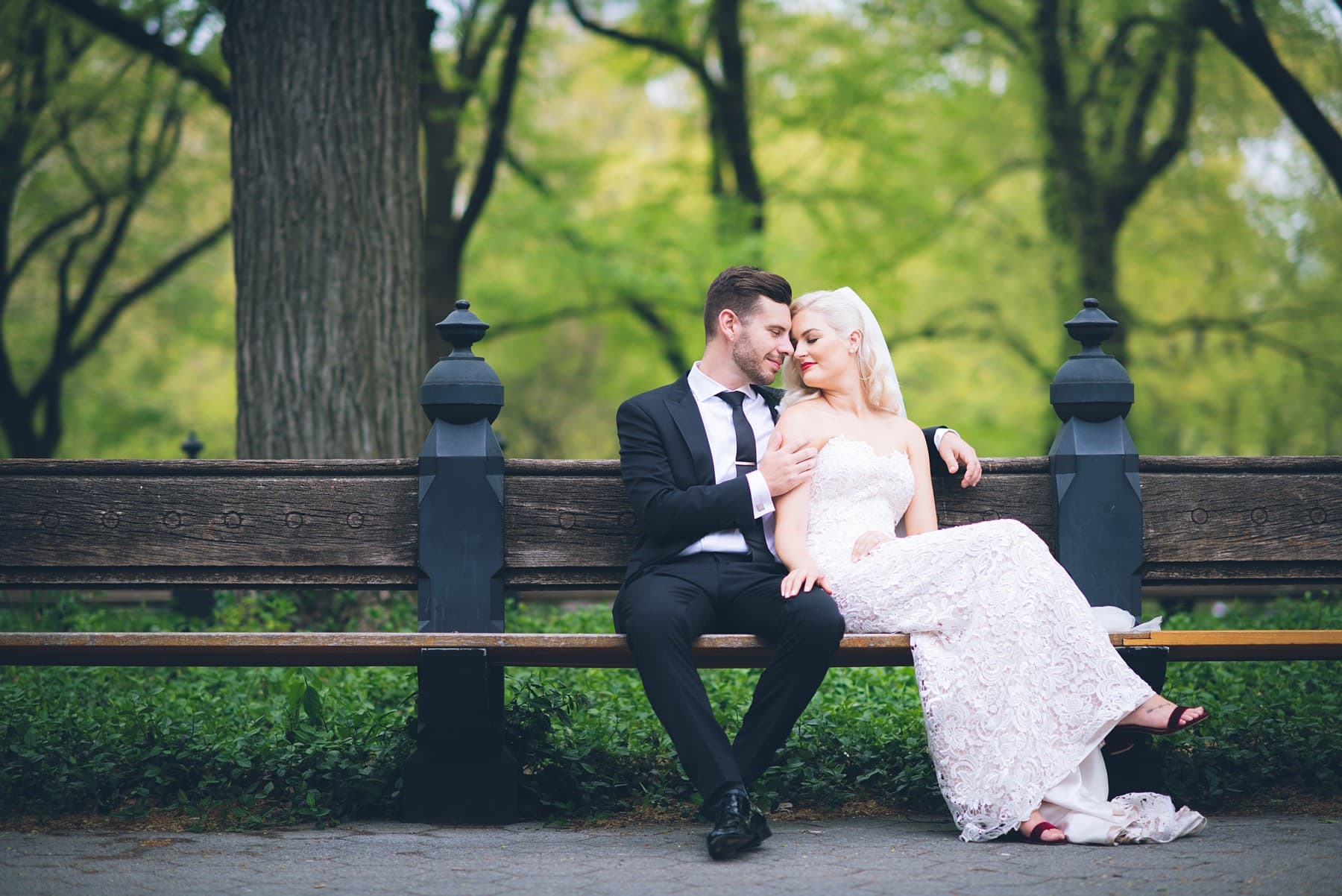 Elopement couple enjoying iconic Central Park on a park bench