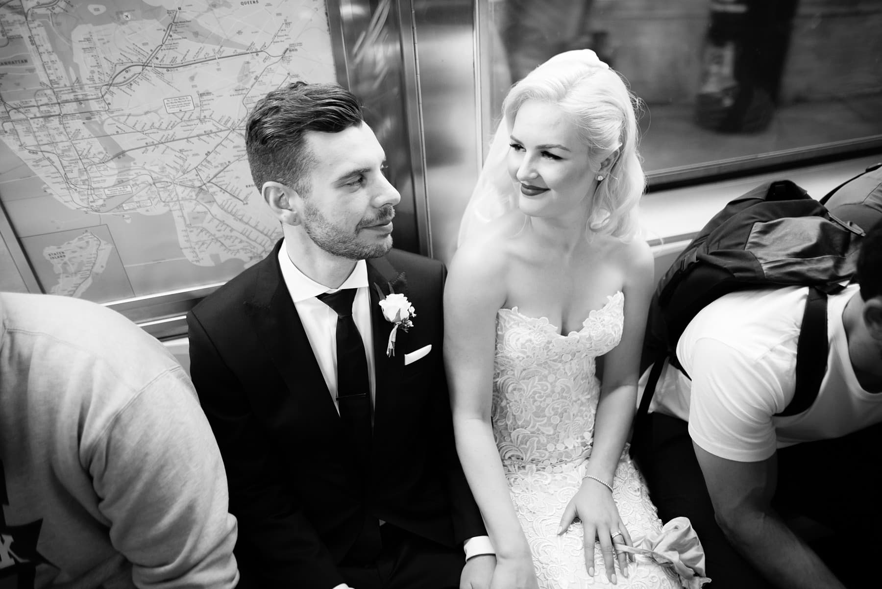 joyful elopement portraits on the subway, New York City rooftop wedding day