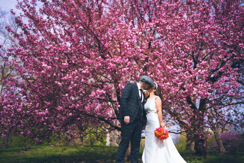 A Couple sharing a kiss during intimate NYC elopement in Central Park
