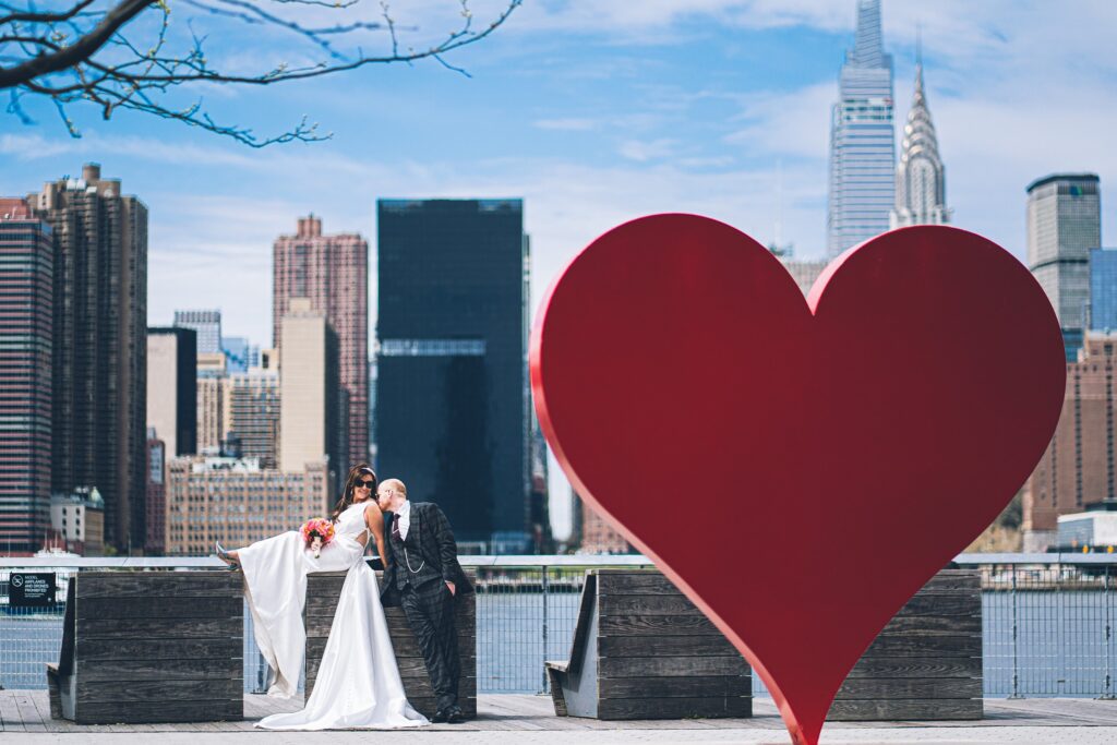 Couple enjoying Manhattan skyline at sunset during NYC elopement