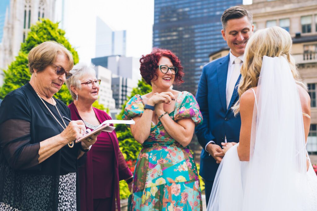 Joyful newlyweds celebrating after their elopement ceremony in New York City.