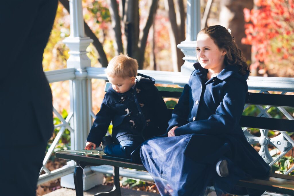 Madeleine, Craig, and their children after their Central Park ceremony at the Ladies Pavilion, officiated by Jackie Reinking, NYC wedding officiant.