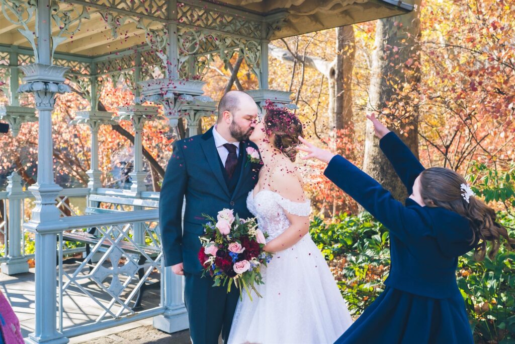Romantic Central Park ceremony at the Ladies Pavilion with Manhattan skyline, perfect for an intimate NYC elopement officiated by Jackie Reinking